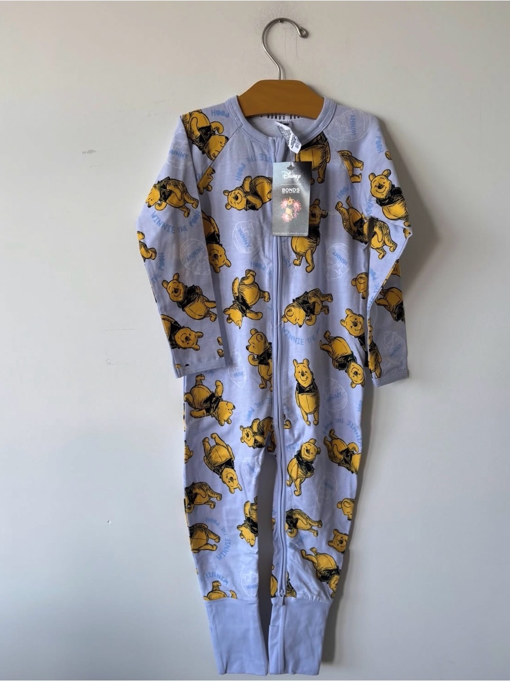 Bonds Lavender Zip-Front Footie with Yellow Winnie the Pooh Print